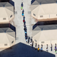 Immigrant children, many of whom have been separated from their parents under a new “zero tolerance” policy by the Trump administration, walk in single file between tents on June 18.